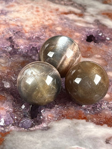 Black moonstone/sunstone sphere