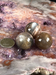 Black moonstone/sunstone sphere